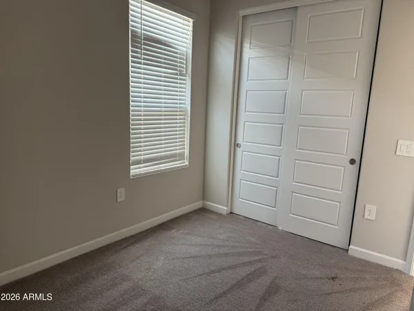 a large kitchen with stainless steel appliances a refrigerator and a stove