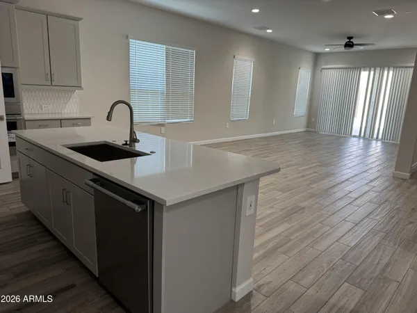 a view of kitchen with cabinets and wooden floor