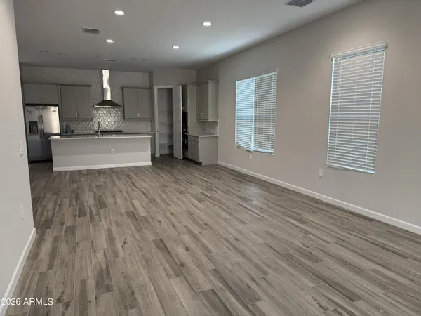 a kitchen with a sink stove and refrigerator