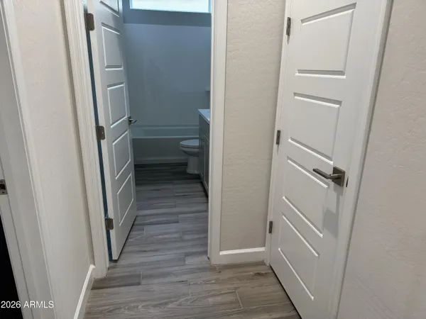 an empty room with closet area