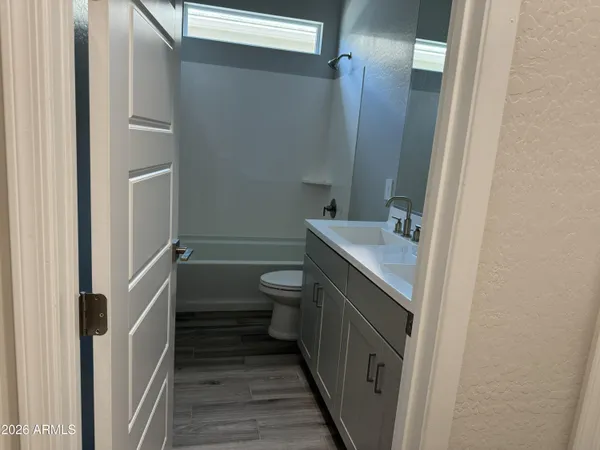 an empty room with wooden floor