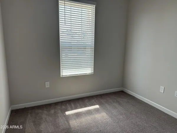 an empty room with wooden door