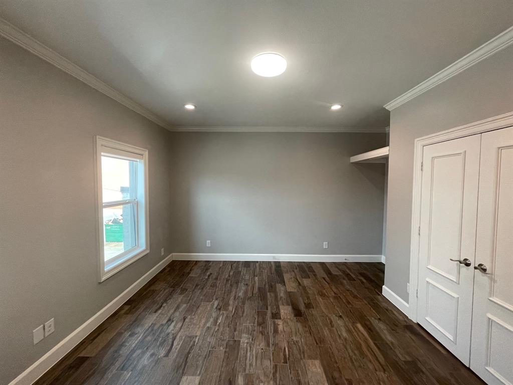 3101 Commerce Street, Unit 203 Dallas, TX 75226 - Photo 14 of 21 wooden floor in an empty room with a window