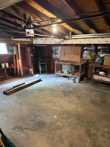 a view of a big room with air conditioner duct and materials on floor