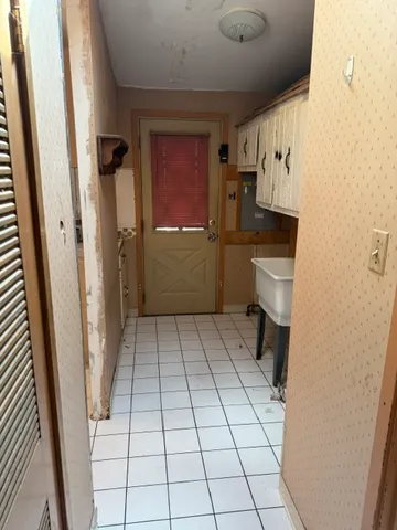 a bathroom with a sink a toilet and a shower