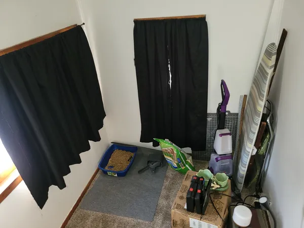 a view of living room with furniture and a window