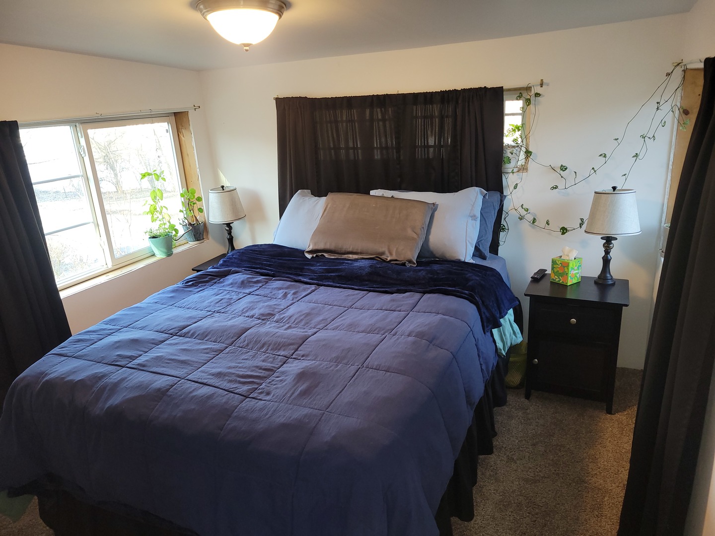 1977 North 3103rd Road, Unit 11 Ottawa, IL 61350 - Photo 12 of 24 a bed sitting in a bedroom next to a window