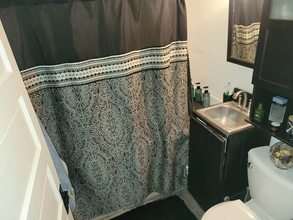 a bathroom with a sink toilet and vanity