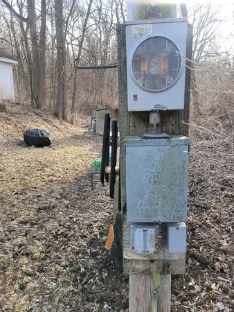 a brick building with a sink and a mirror