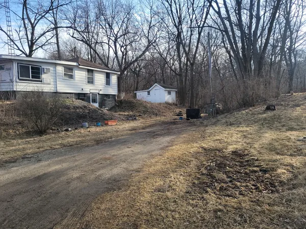 a view of a house with a snow in the yard