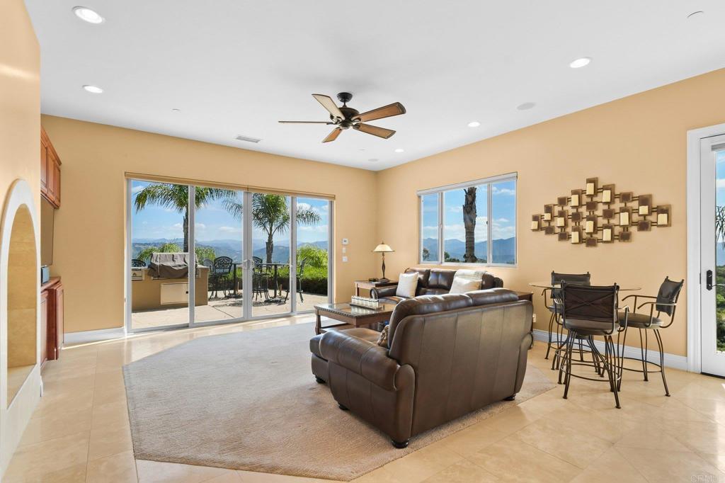 164 Dawn View Way El Cajon, CA 92021 - Photo 15 of 38 a living room with furniture and a floor to ceiling window