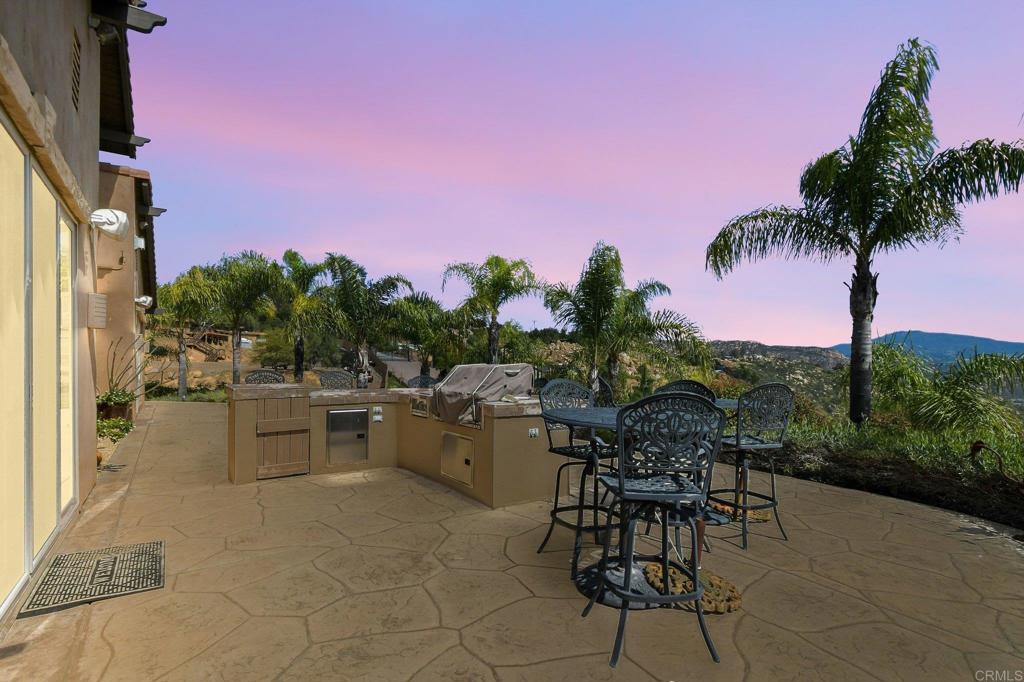 164 Dawn View Way El Cajon, CA 92021 - Photo 3 of 38 a view of a patio with a dining table and chairs with a garden