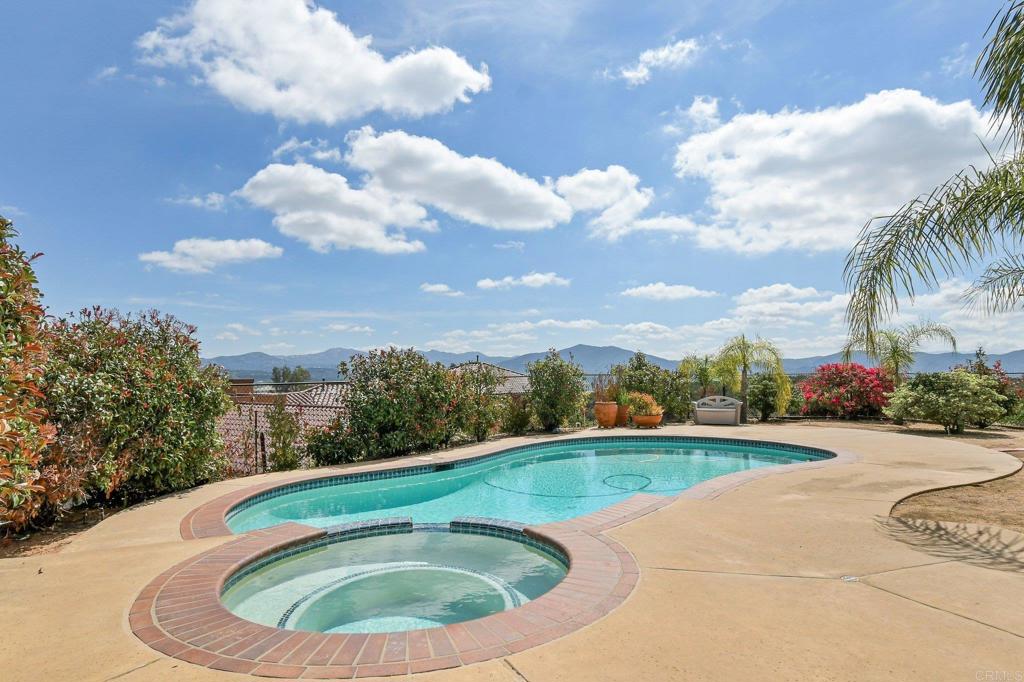 164 Dawn View Way El Cajon, CA 92021 - Photo 33 of 38 a view of a swimming pool with a yard