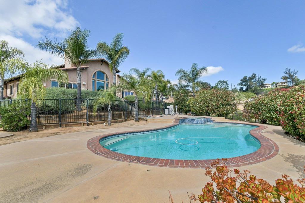 164 Dawn View Way El Cajon, CA 92021 - Photo 34 of 38 a view of a swimming pool with a yard