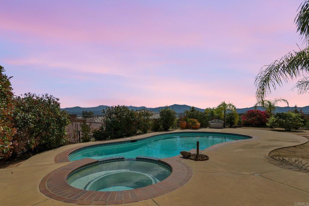 164 Dawn View Way El Cajon, CA 92021 - Photo 6 of 38 a view of a swimming pool with a yard