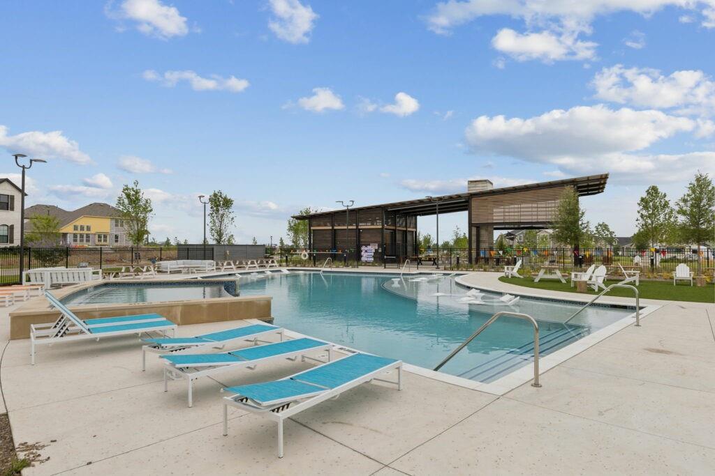 2837 Bluejack Road McKinney, TX 75071 - Photo 34 of 40 a view of a swimming pool and lounge chair