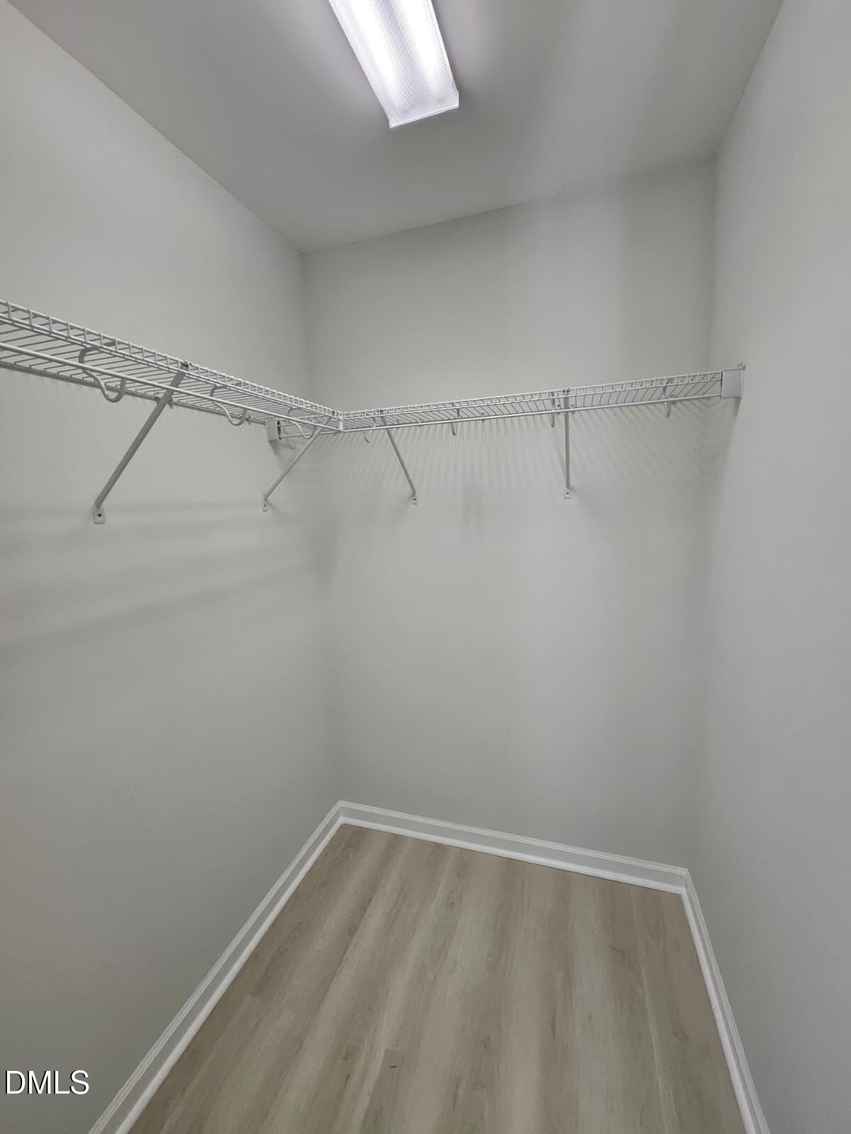 239 Tuscan Ridge Way Clayton, NC 27527 - Photo 26 of 36 a view of a room with racks on the wall