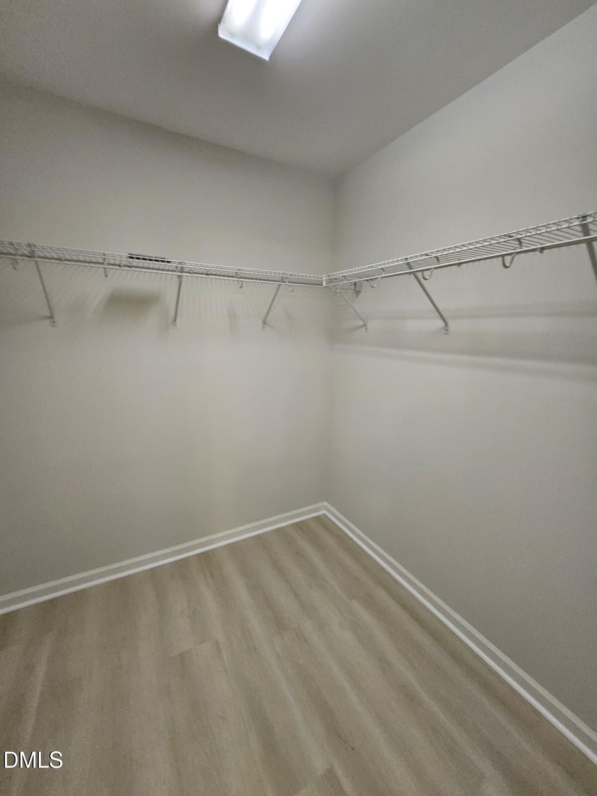 239 Tuscan Ridge Way Clayton, NC 27527 - Photo 27 of 36 a view of a room with racks on the wall
