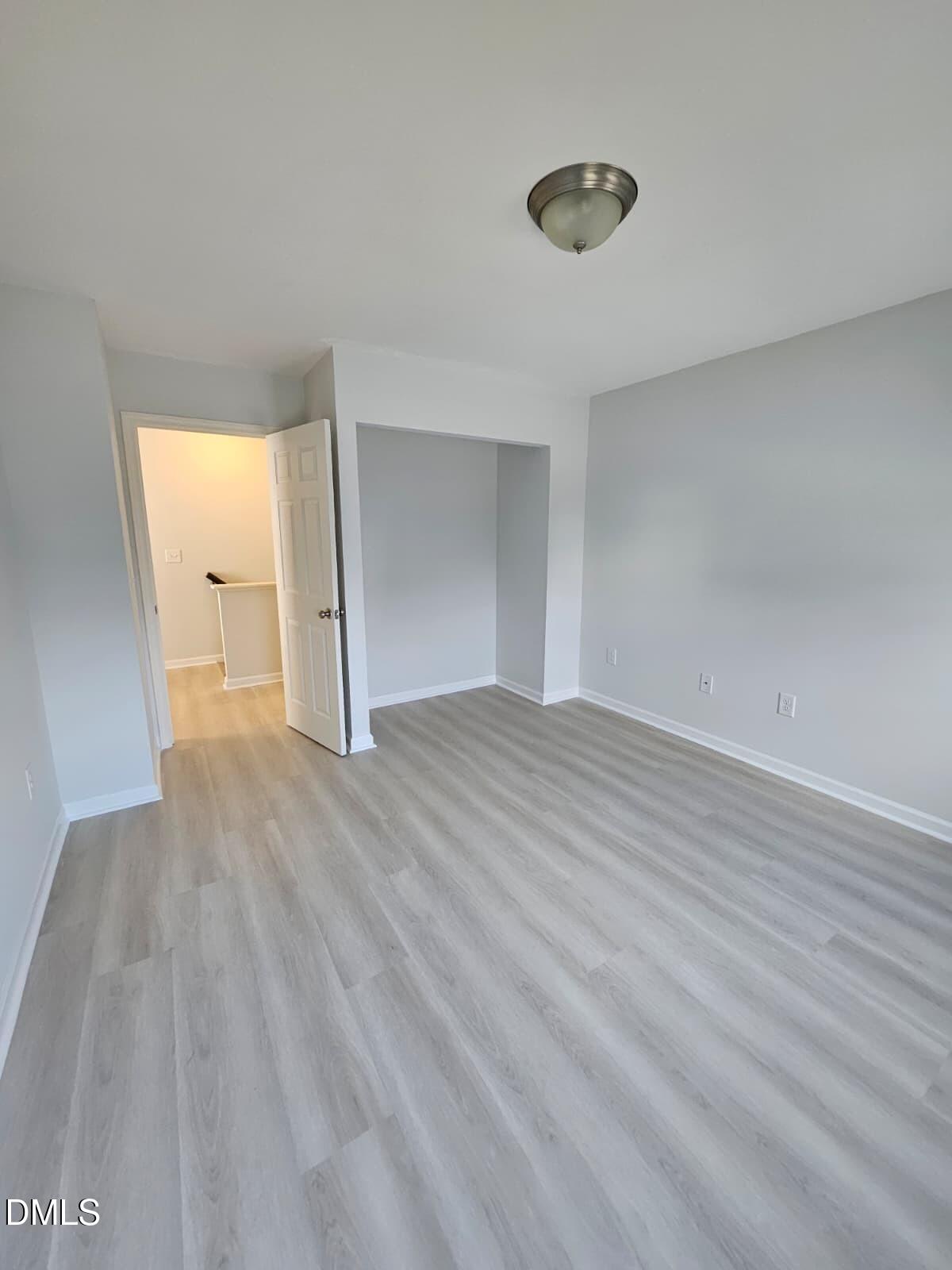 239 Tuscan Ridge Way Clayton, NC 27527 - Photo 29 of 36 a view of empty room with wooden floor