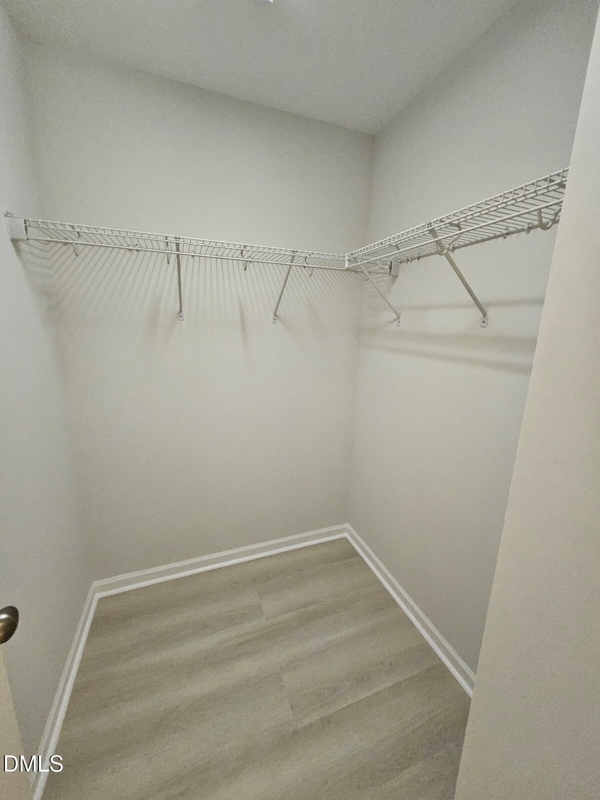 239 Tuscan Ridge Way Clayton, NC 27527 - Photo 31 of 36 a view of a room with racks on the wall