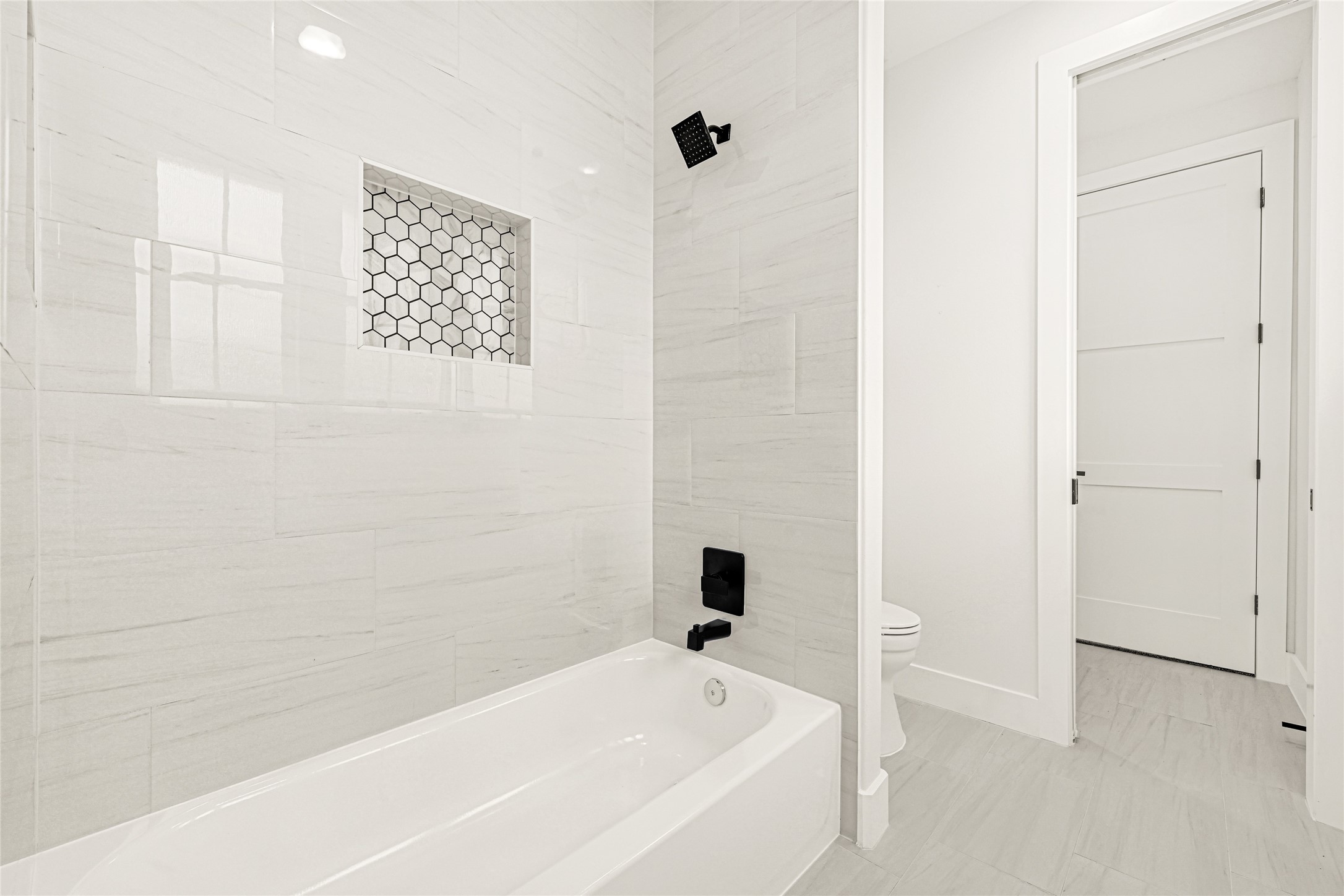 16915 Hamill Drive Rosharon, TX 77583 - Photo 32 of 47 a bathroom with a bathtub and shower