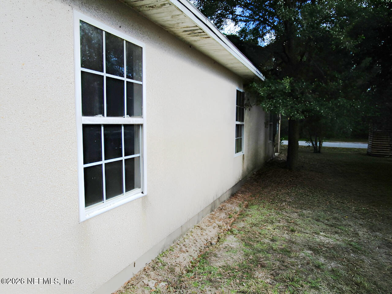 7070 3rd Street St. Augustine, FL 32092 - Photo 6 of 22 a view of an empty room with a window
