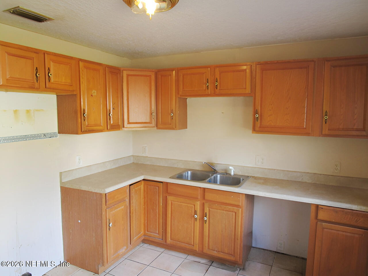 7070 3rd Street St. Augustine, FL 32092 - Photo 7 of 22 a kitchen with sink cabinets and utility