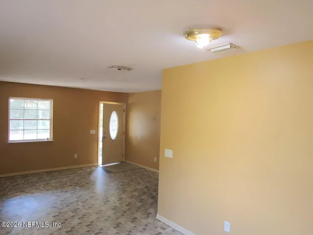 a view of a room with a window