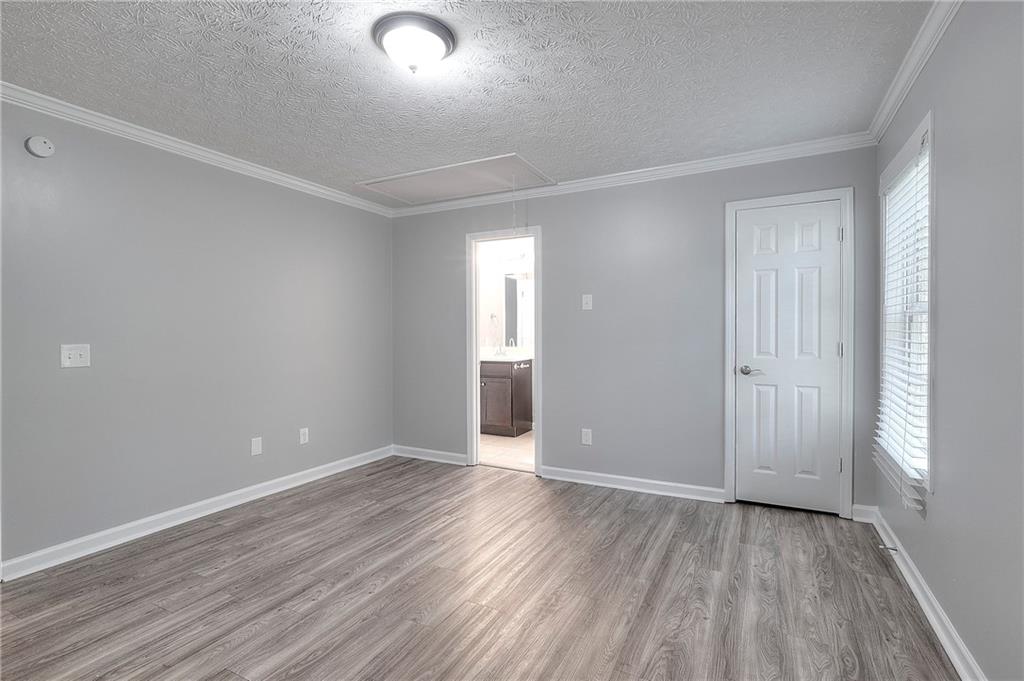 372 Ashton Way Winder, GA 30680 - Photo 20 of 29 wooden floor in an empty room with a window