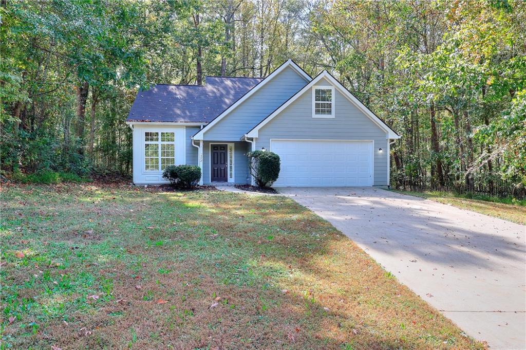 372 Ashton Way Winder, GA 30680 - Photo 2 of 29 a front view of a house with yard and green space