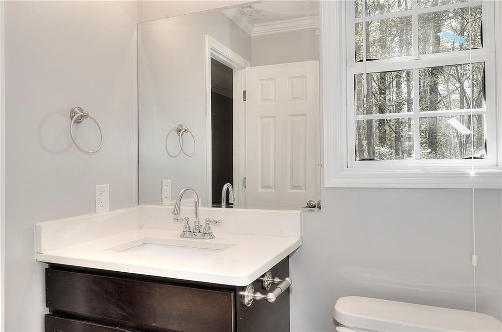 372 Ashton Way Winder, GA 30680 - Photo 21 of 29 a bathroom with a sink toilet and a mirror
