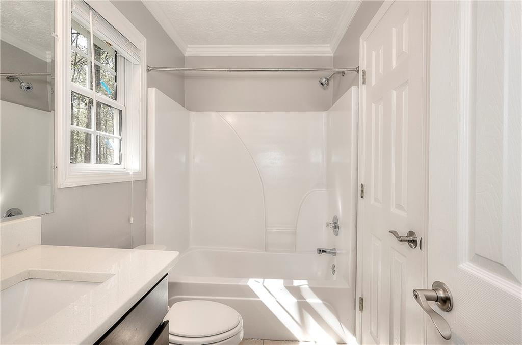 372 Ashton Way Winder, GA 30680 - Photo 22 of 29 a bathroom with a sink toilet and shower
