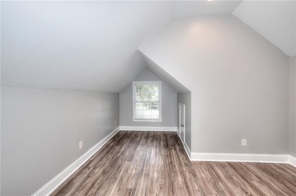 372 Ashton Way Winder, GA 30680 - Photo 26 of 29 a view of a room with wooden floor and window