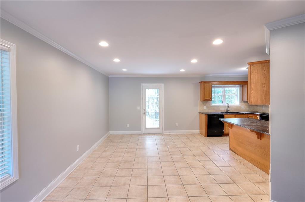 372 Ashton Way Winder, GA 30680 - Photo 6 of 29 a view of a kitchen with a sink and a refrigerator