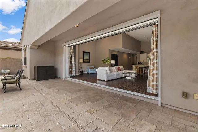 a swimming pool with outdoor seating and yard