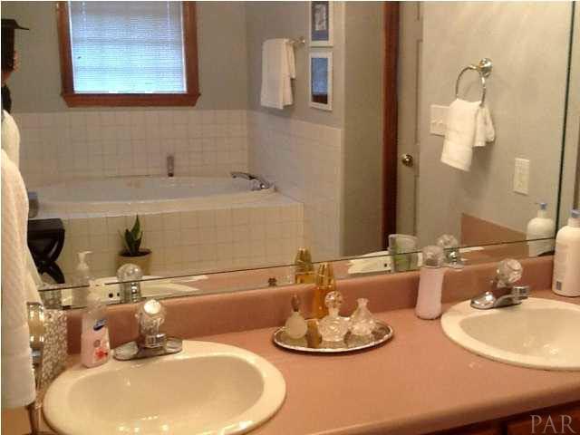 5330 Morgan Ridge Drive Milton, FL 32570 - Photo 11 of 25 Master Bath with Double Vanity and Wood Cabinets