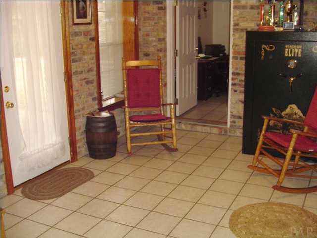 5330 Morgan Ridge Drive Milton, FL 32570 - Photo 18 of 25 Den with Tile Flooring and Access to the Covered Patio