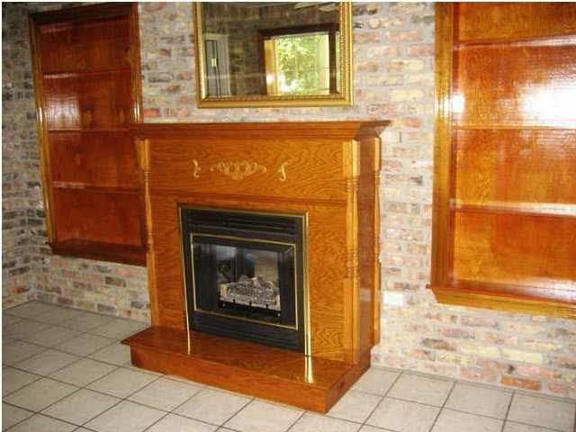 5330 Morgan Ridge Drive Milton, FL 32570 - Photo 19 of 25 Fireplace - Propane Gas and Built-in Solid Wood Bookshelves.