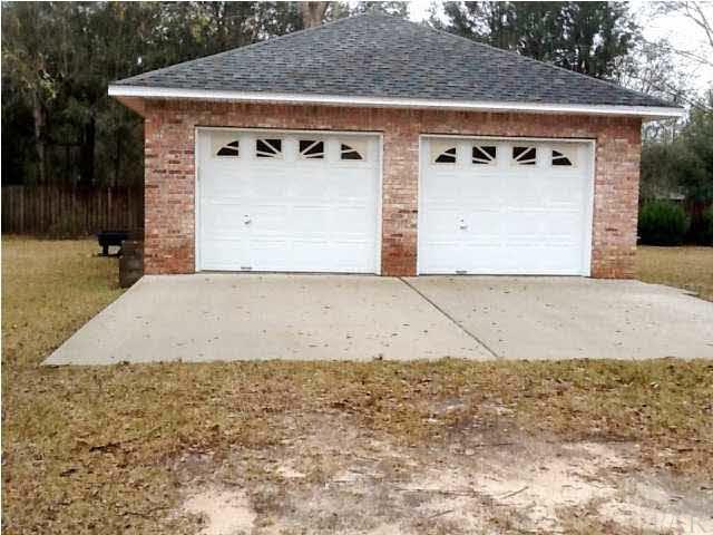 5330 Morgan Ridge Drive Milton, FL 32570 - Photo 21 of 25 24 x 24 Multipurpose Building has Electric Doors and Lights all Connected. Great for Boat Storage, Workshop, Just about Anything You would want to use it for.