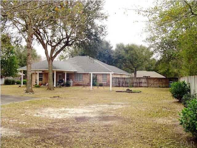 5330 Morgan Ridge Drive Milton, FL 32570 - Photo 23 of 25 Back View of the House. Note the Large Covered Patio that has a Continuation of the House Roof. Great for Making a Future Florida Room.