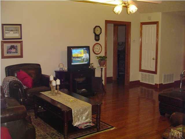 5330 Morgan Ridge Drive Milton, FL 32570 - Photo 3 of 25 Living Room with Lighted Plant Shelves