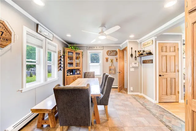 a view of a dining room with furniture window and outside view