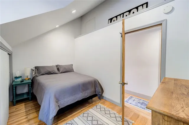 a bedroom with a bed and a table