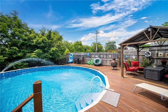 a view of a swimming pool with sitting area