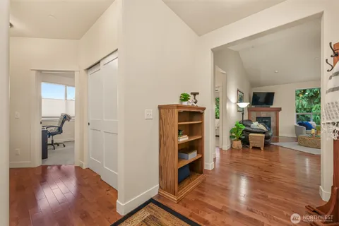 a view of a livingroom with furniture and an empty room