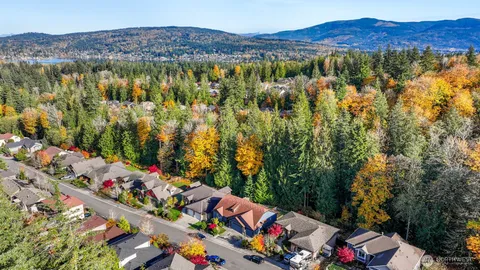 an aerial view of city and mountain