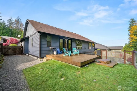 a front view of a house with porch and garden
