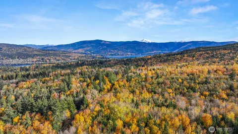 a view of a city with mountains in the background