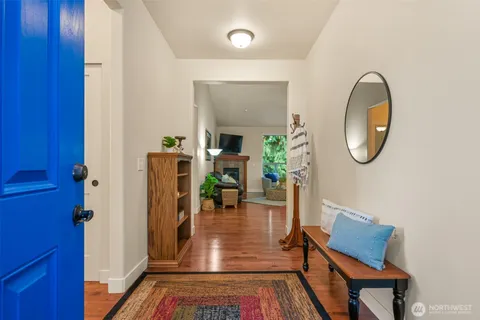 a view of an entryway with wooden floor