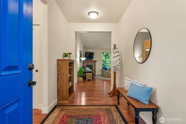 a view of an entryway with wooden floor